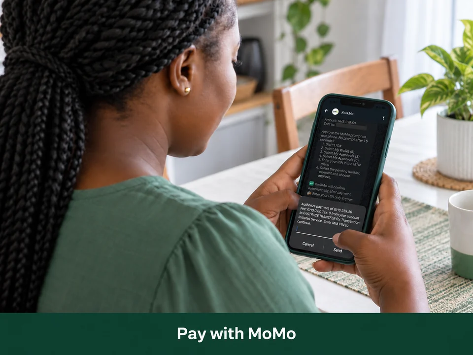 A shopper approves a KwikMo Mobile Money payment on her phone